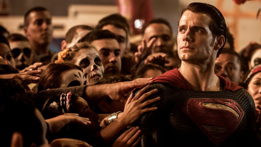 Henry Cavill as Superman surrounded by a crowd reaching for him in Batman v Superman: Dawn of Justice (2016)
