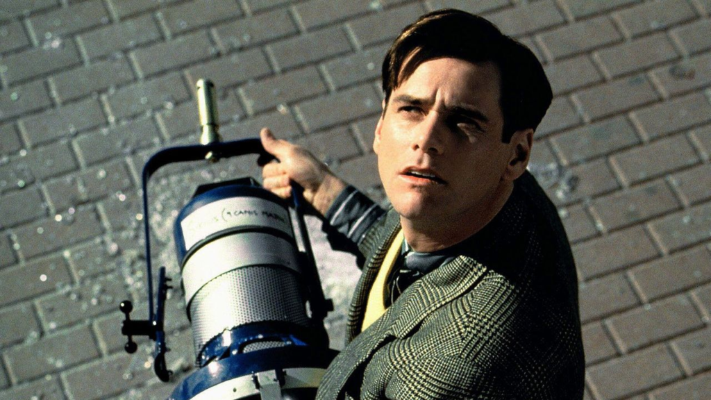 Jim Carrey holding a lamp in The Truman Show (1998)