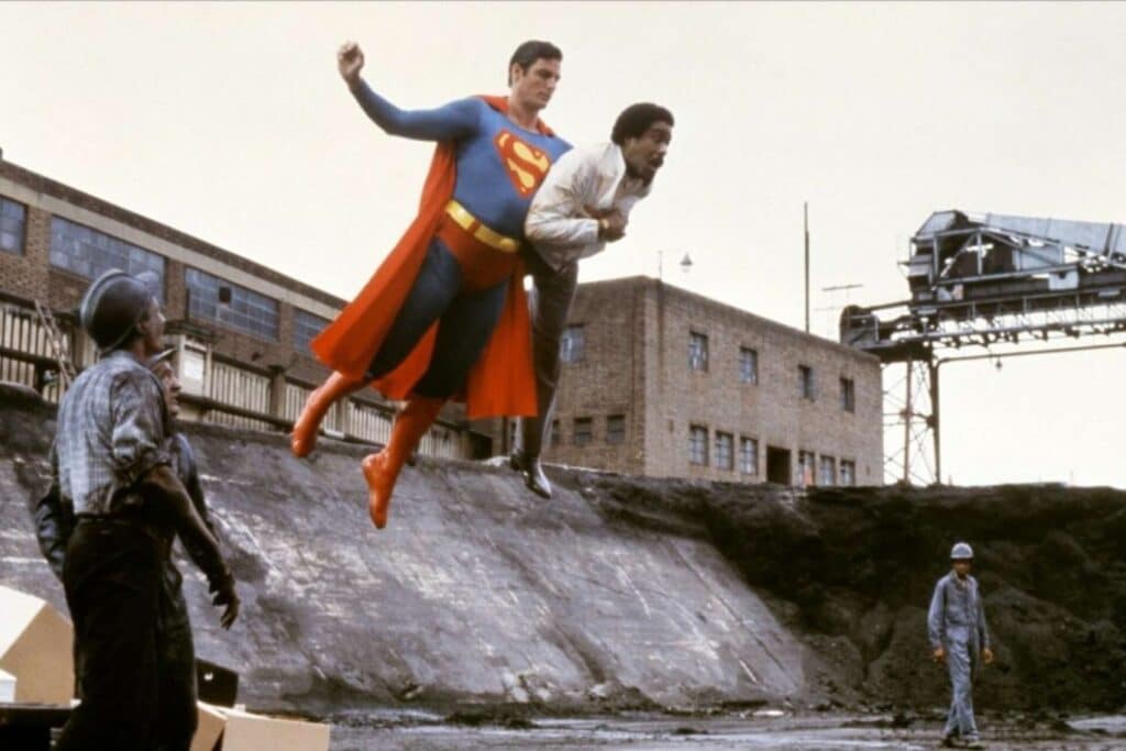 Christopher Reeve as Superman carrying Richard Pryor as Gus Gorman to safety in Superman III (1983)